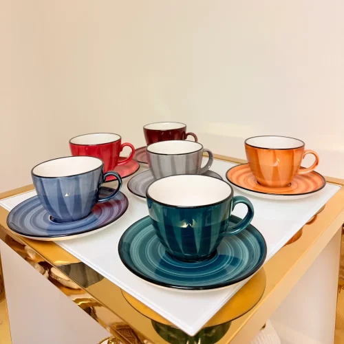 ceramic coffee and tea cups with saucers